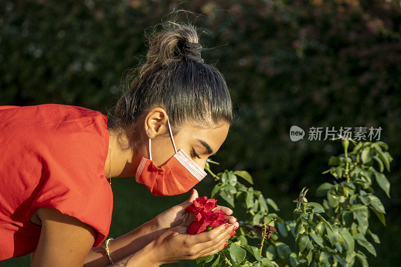 young girl working with the mask for the reason of covid 19